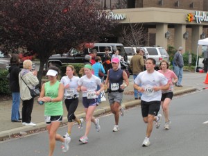 Around mile 20 with my Leesburg runner friend; the hotel my husband and I stayed in is in the background.